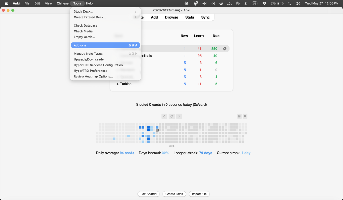 Anki Tools menu open with Add-ons highlighted, showing other menu items and a heatmap visible in the background